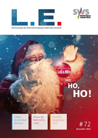Das Bild zeigt das Cover der Ausgabe 72 des "L.E. Magazins", das einen Weihnachtsmann mit dem Schriftzug "HO, HO!" zeigt. Es wirkt festlich, mit Schneeflocken und einem roten Hintergrund, was zur weihnachtlichen Stimmung beiträgt.