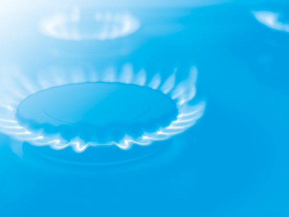 Ein abstraktes Bild von leuchtenden weißen Gasflammen auf einem blaufarbenen Hintergrund